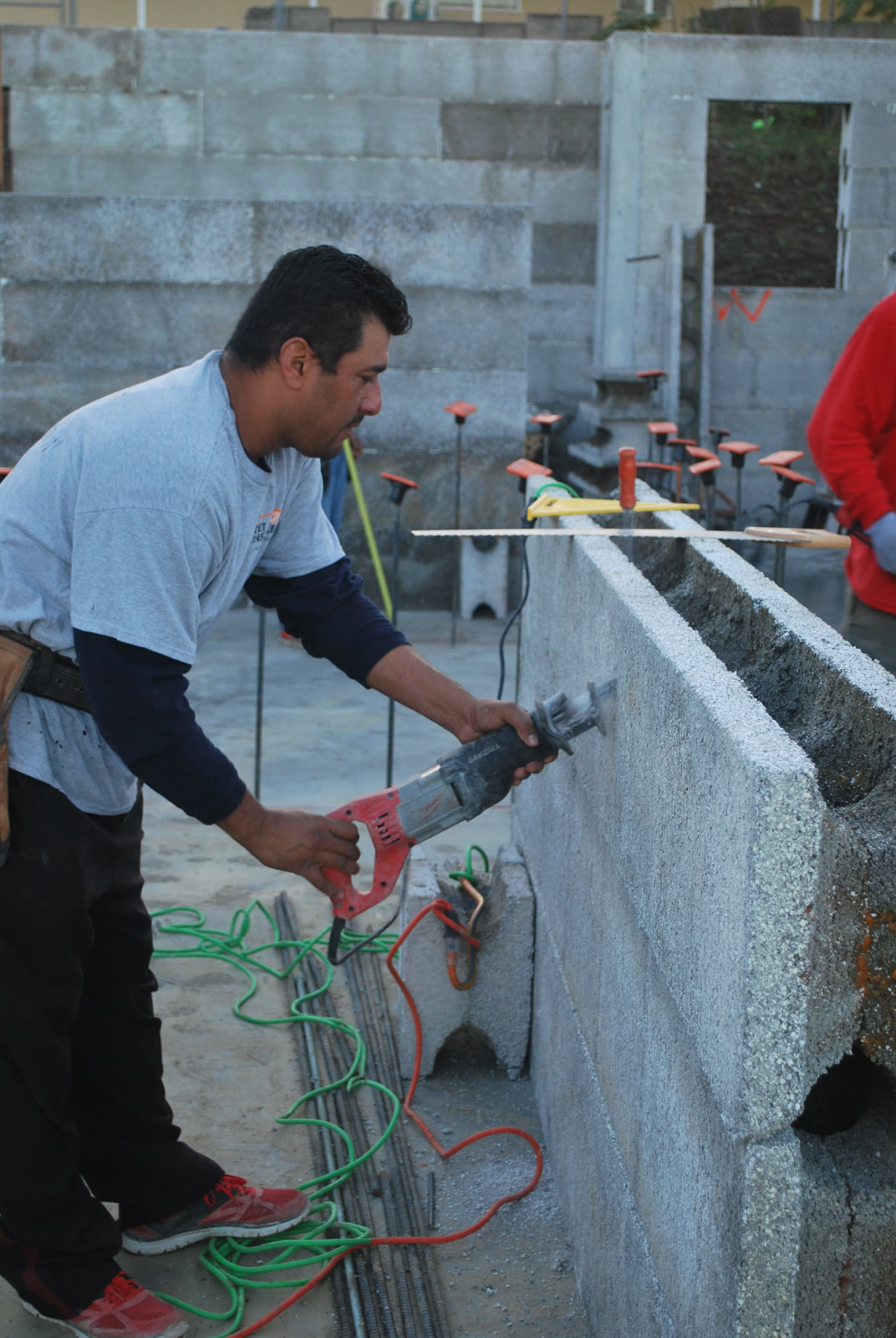 A saw cutting a Legacy ICF form on a job site.